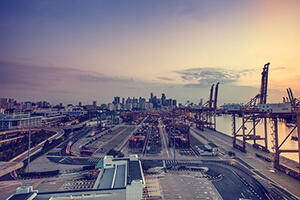 Skyline, roads, and harbor at sunset. logistics as a service.