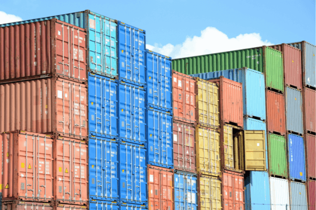 Stacks of cargo containers against a blue sky